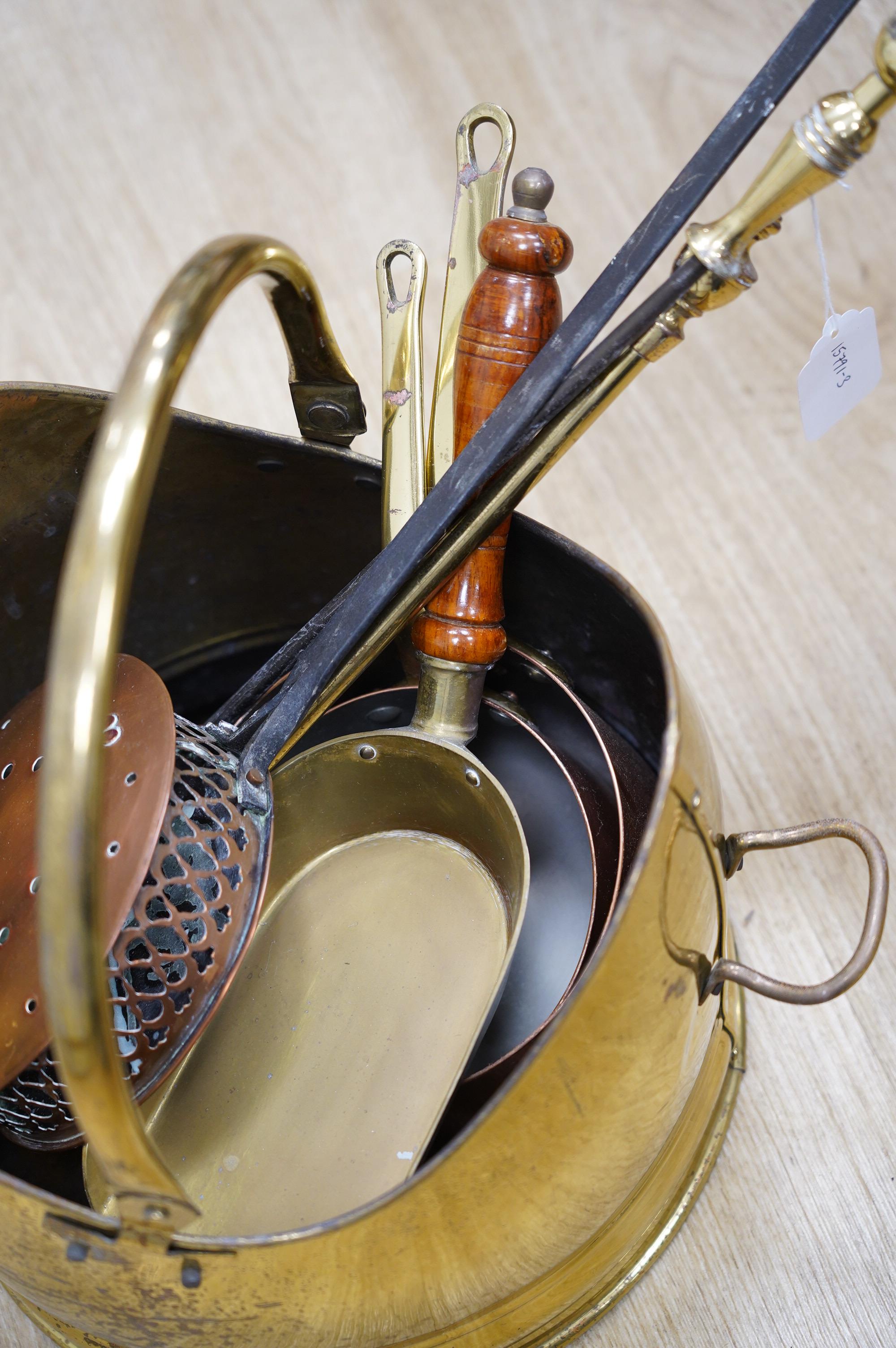 A quantity of copper and brass ware to include coal scuttle and warming pan. Condition - fair to good